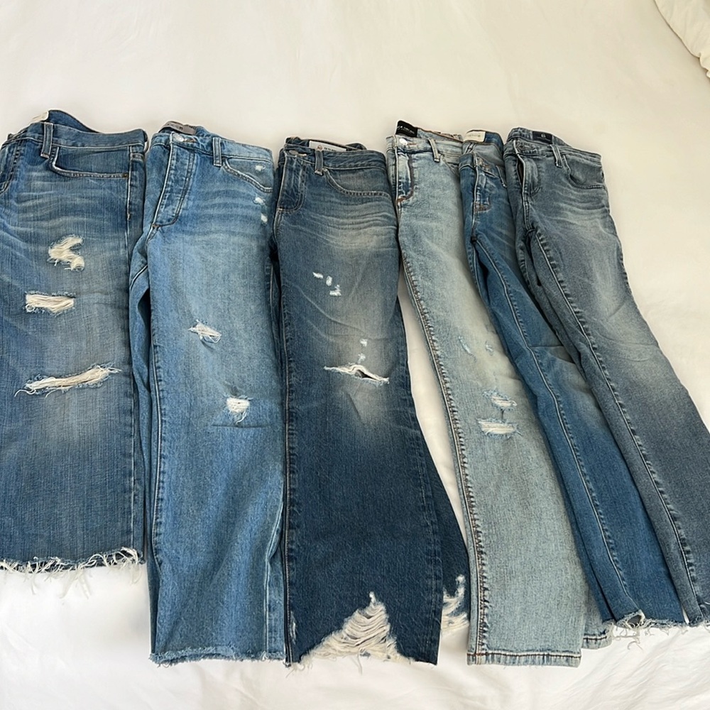 Set of 6 pairs of jeans. All new or great used condition. Sizes 25-26 waist